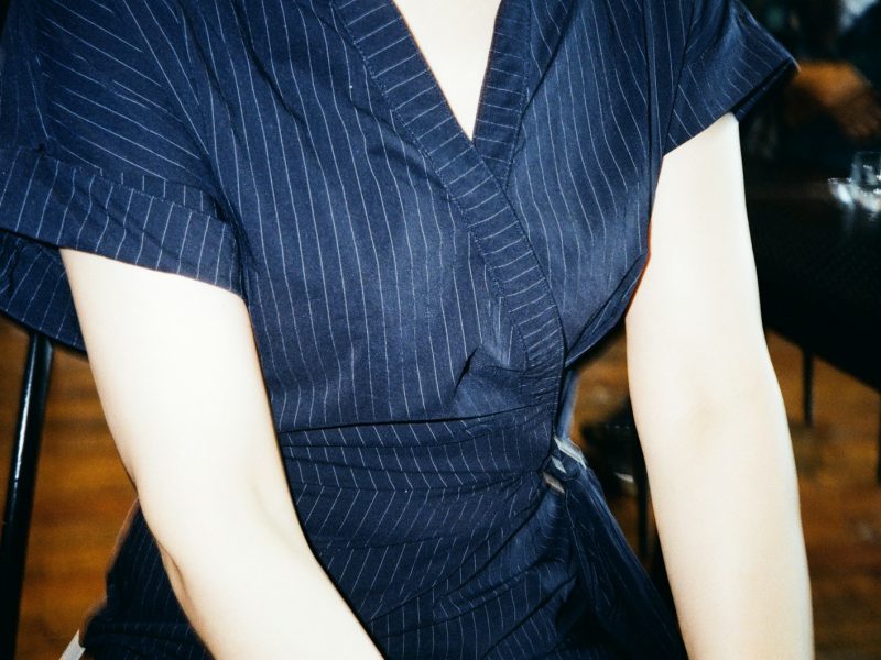 person in blue and white stripe button up shirt